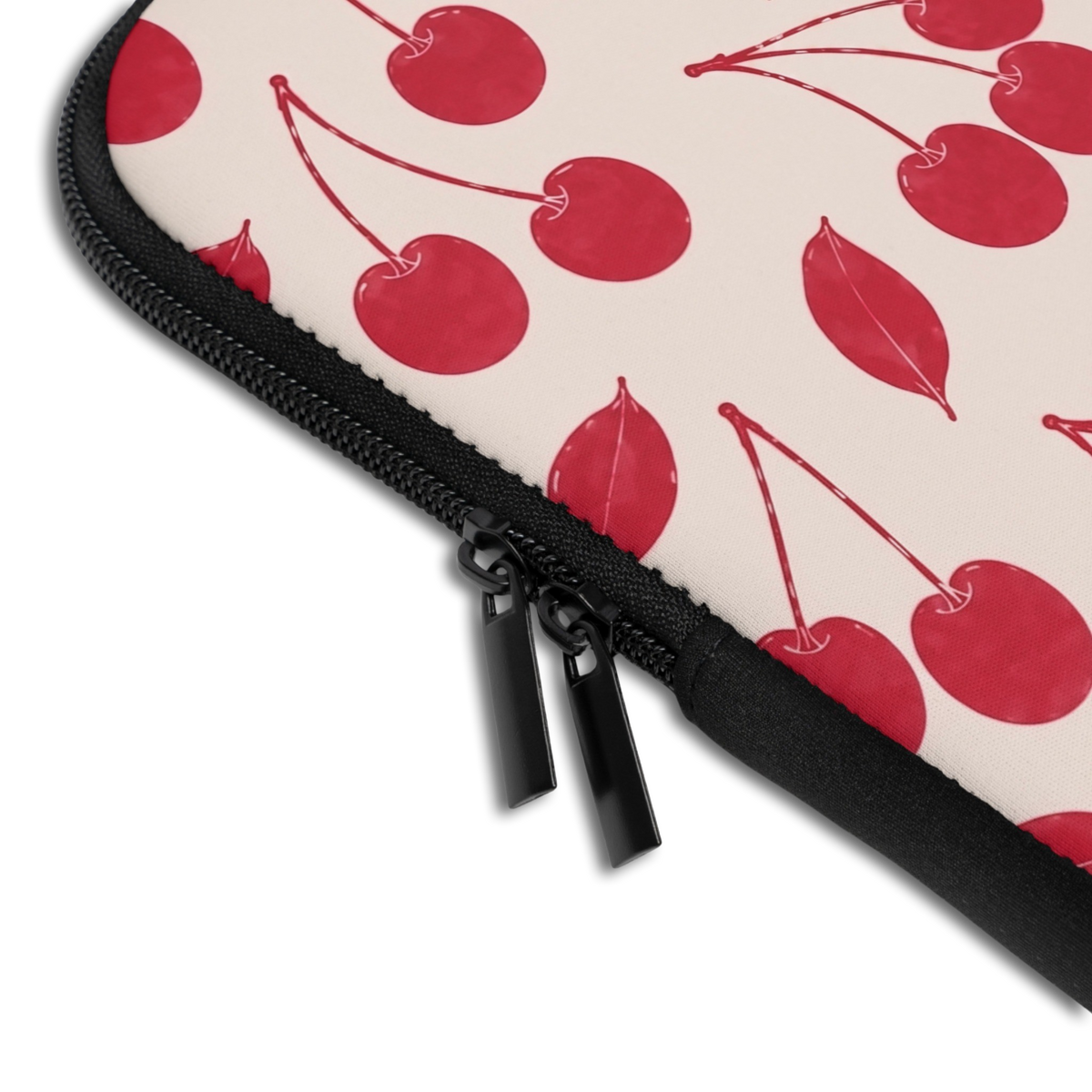 Close-up of the Personalized Cherry Pair Laptop Sleeve sleeve corner showing the printed design, the padded edge and the dual zipper pulls