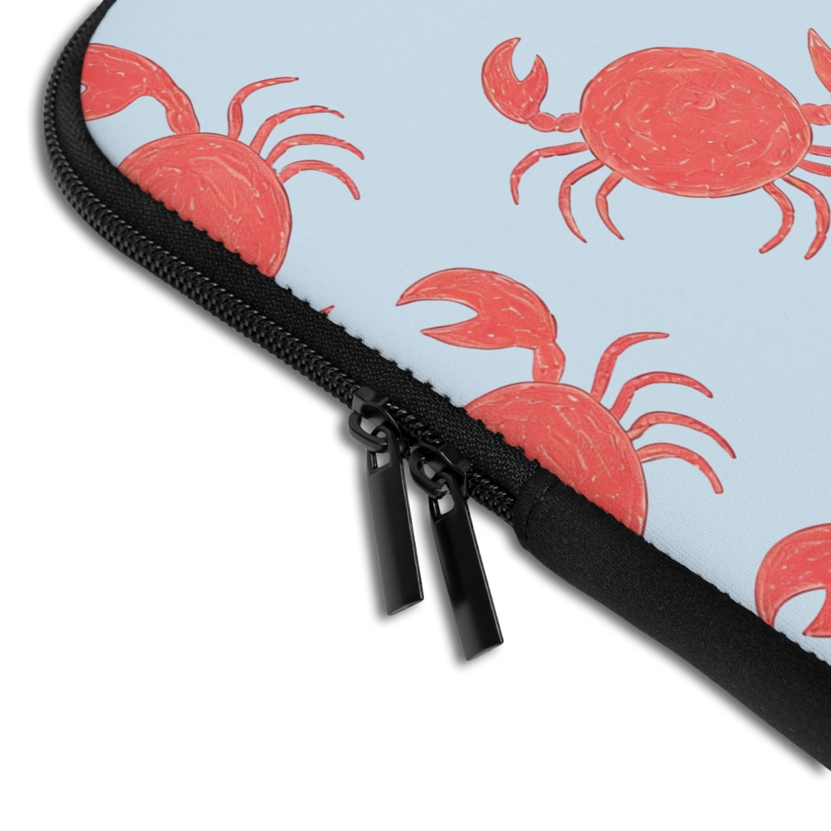 Close-up of the Personalized Dancing Crabs Laptop Sleeve sleeve corner showing the printed design, the padded edge and the dual zipper pulls