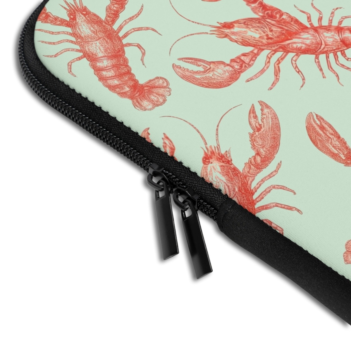 Close-up of the Personalized Lucky Lobsters Laptop Sleeve sleeve corner showing the printed design, the padded edge and the dual zipper pulls